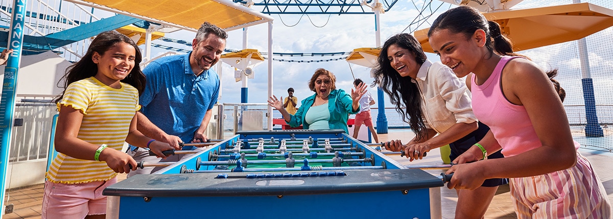 a family playing a game of foosball