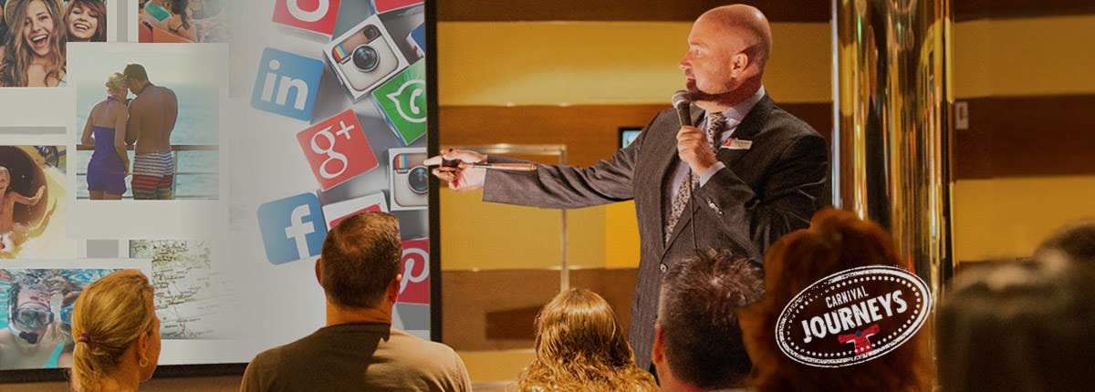 man giving presentation on carnival journeys cruise with carnival journeys logo