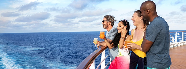 guests enjoying drinks and the view on the lido deck