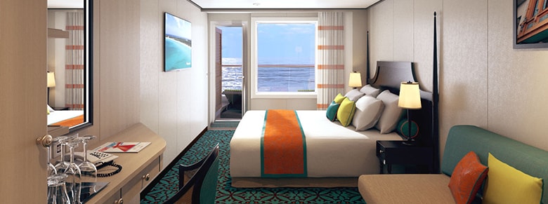 group of guests lounging in pool chairs enjoying drinks