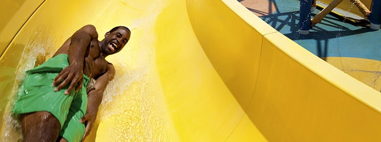  Outdoor Activities - boy going down a slide at waterworks on carnival cruise line