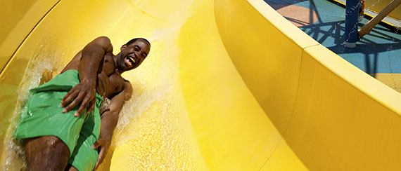  Outdoor Activities - boy going down a slide at waterworks on carnival cruise line