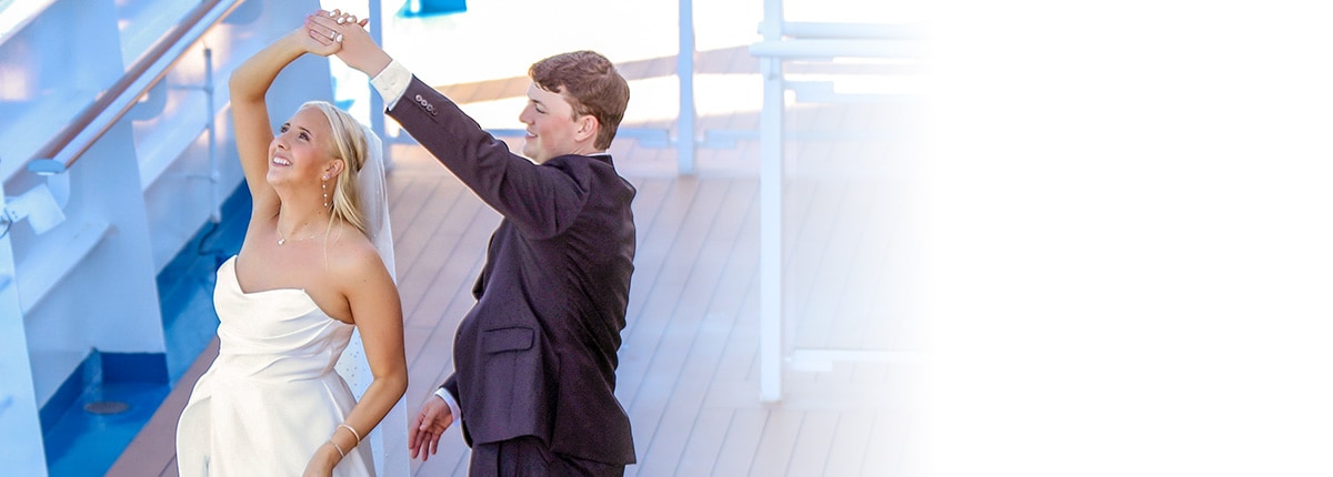 a married couple dancing onboard a carnival cruise ship