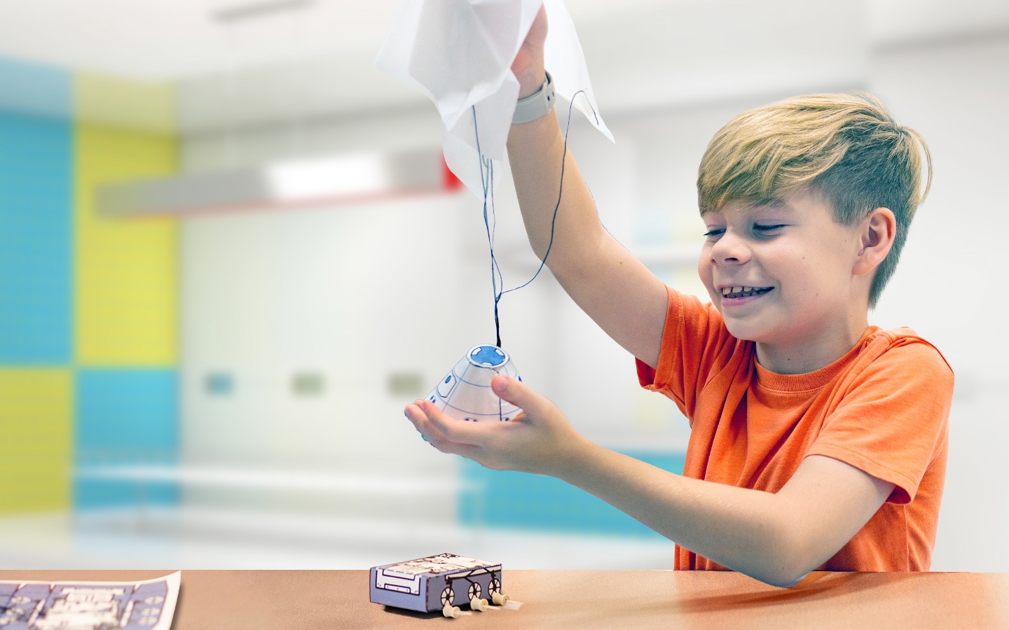 a yound man plays with a space learning object