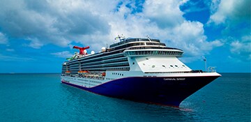carnival spirit sails out into the sea on a sunny day