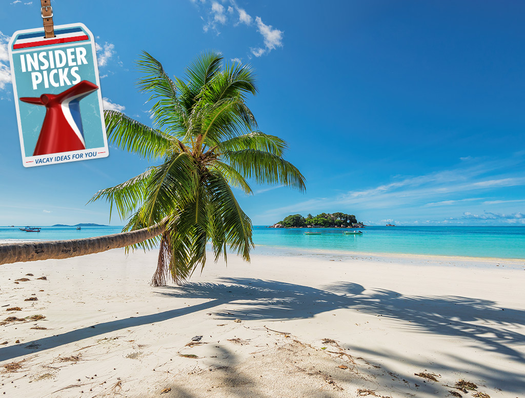a white sandy beach with the clear blue water on a sunny day