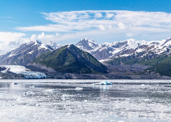 A view of snow capped mountains by Hubbard Glacier