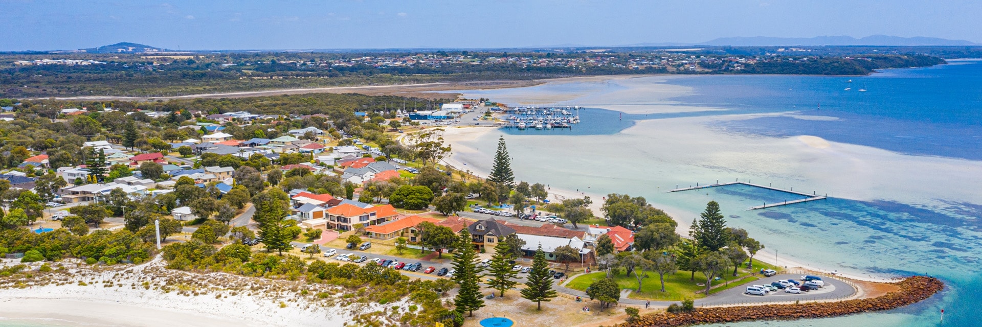 homes are surounded by the ocean located in albany