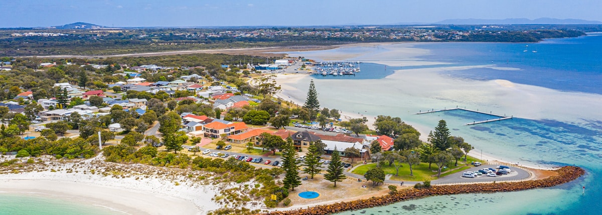 homes are surounded by the ocean located in albany