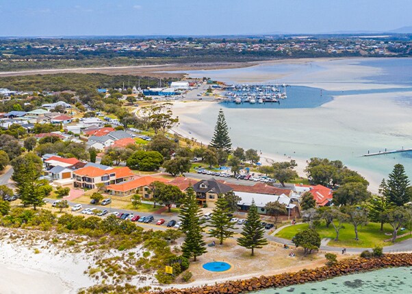 homes are surounded by the ocean located in albany