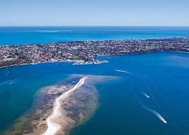 the ocean brushes up on a coast in fremantle