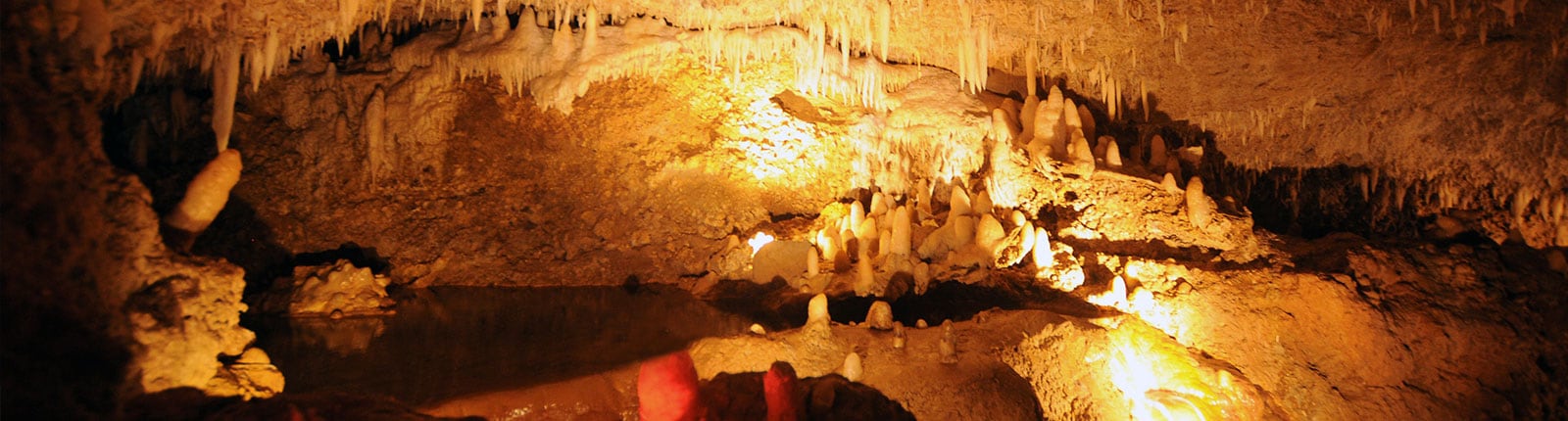 Brightly lit stalagmites in a cave on Barbados