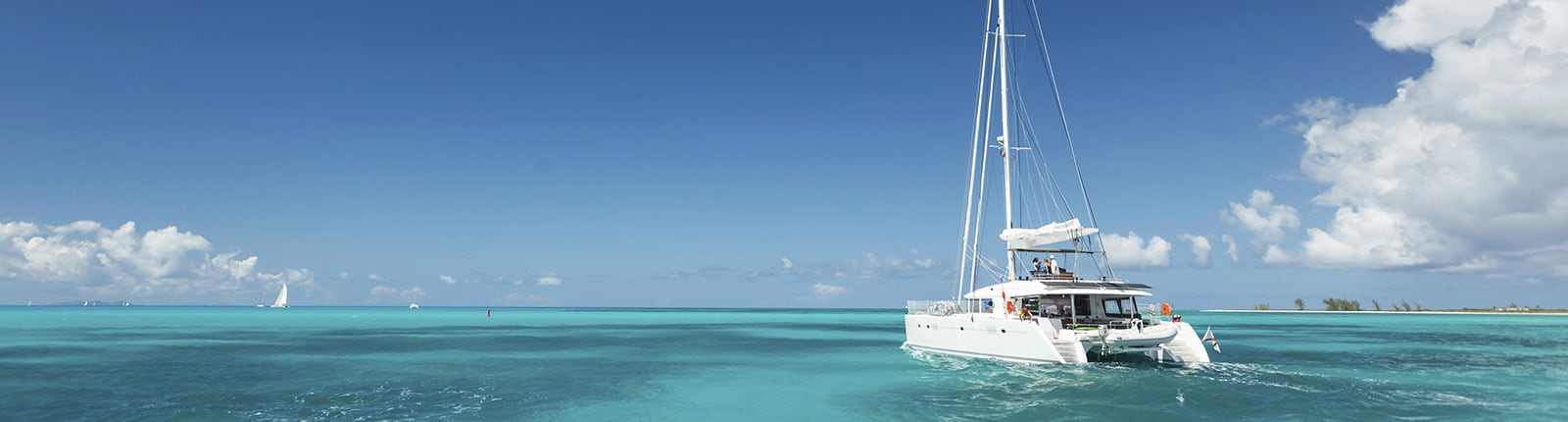 Catamaran sailing in the blue waters alongside Barbados