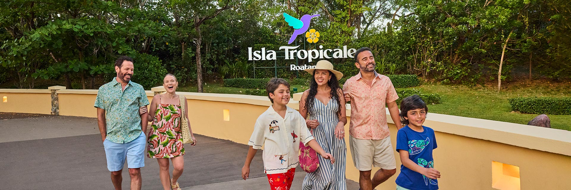 guests walking in front of a isla tropicale sign