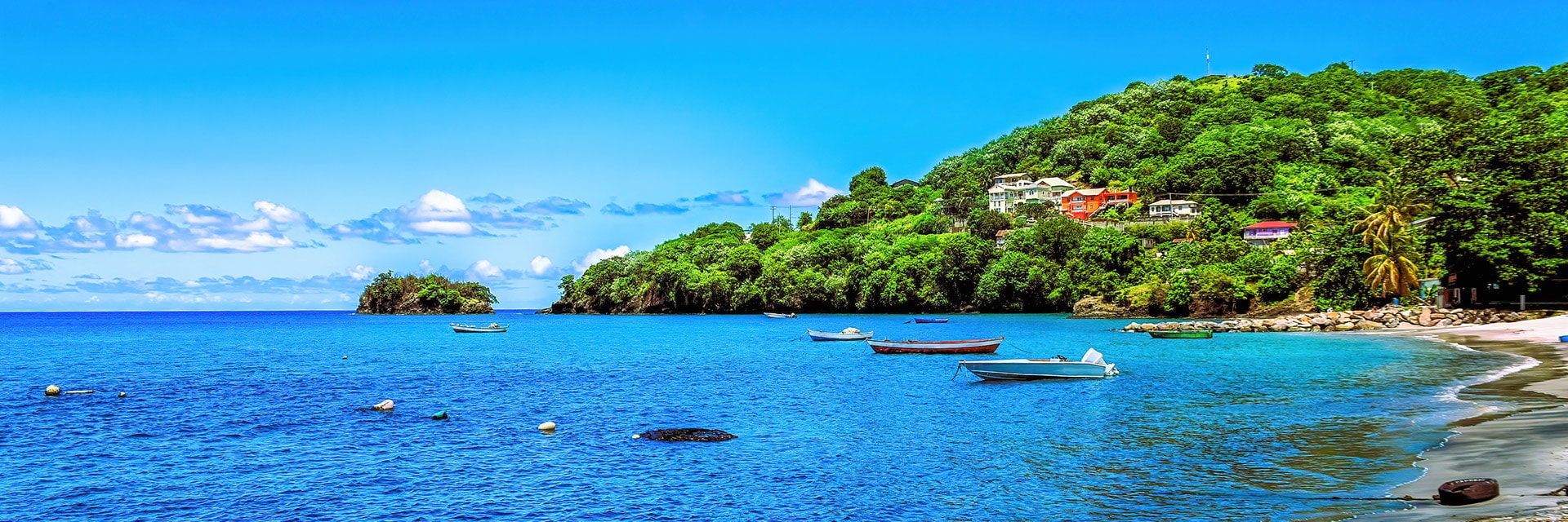view of a natural poole coral reefs with sail boats