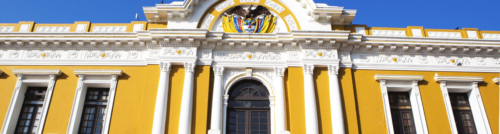 Historic yellow building downtown in Santa Marta, Columbia