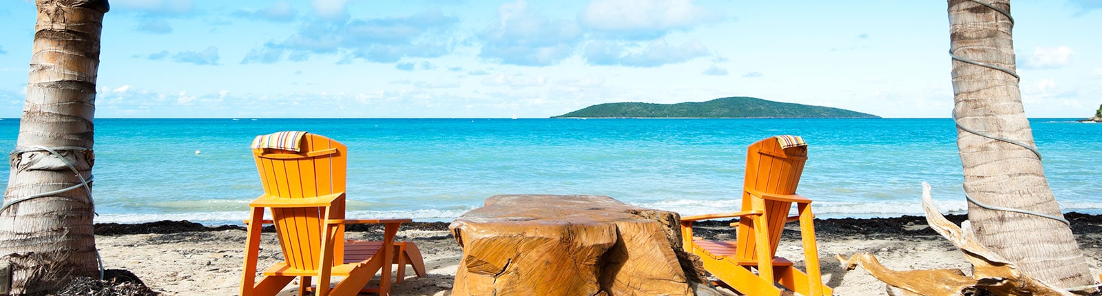 Sitting in yellow beach chairs enjoying the view of the blue waters of St. Croix