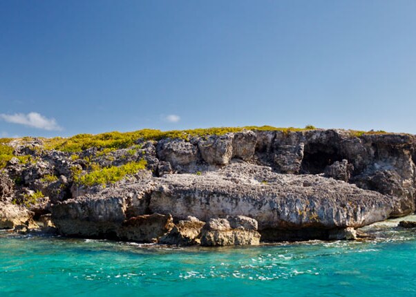 blue water and rocky coast in antigua
