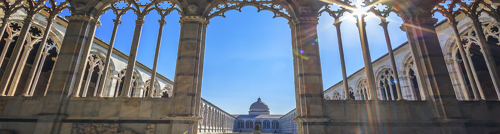 Looking through historic ornate arches in Livorno, Italy