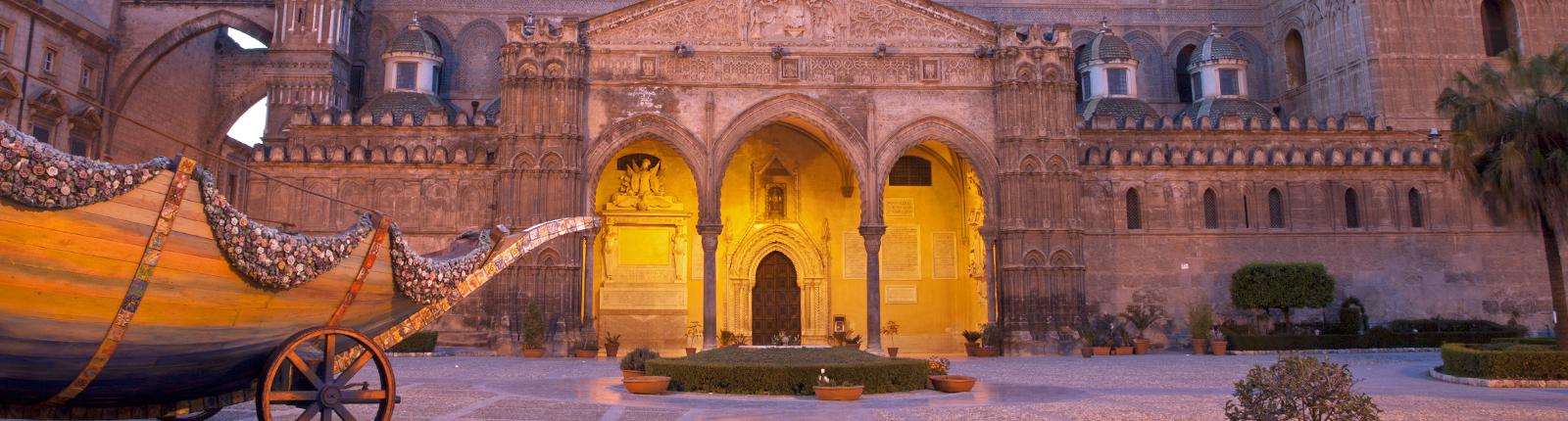 Warmly lit courtyard of the Cathedral of Palermo in Palermo, Italy