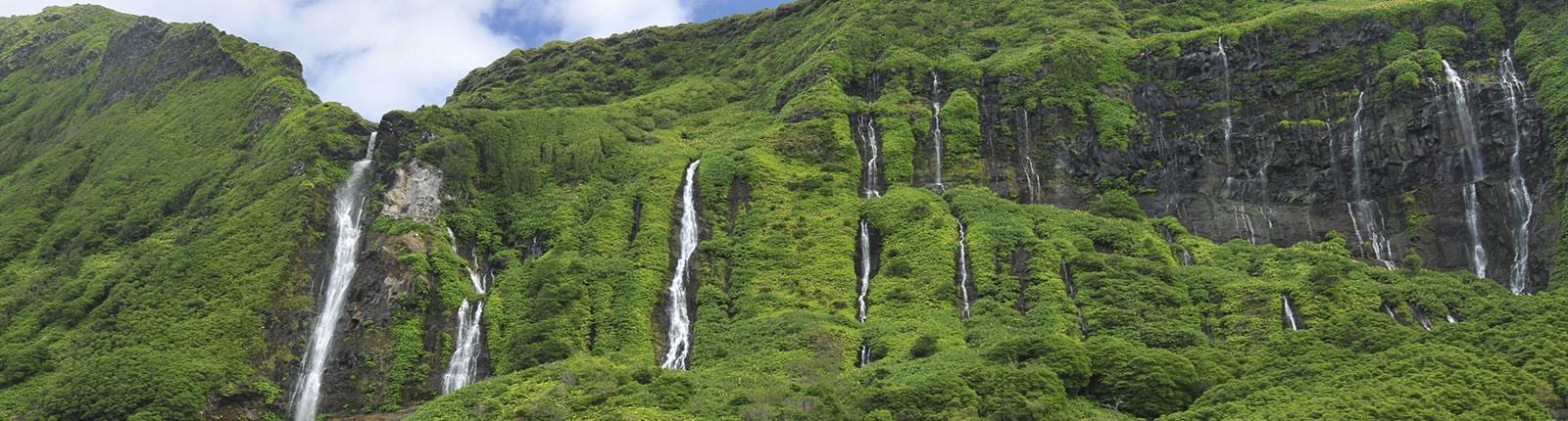 Looking up at waterfalls at Ribeira Grande in Ponta Delgada, Portugal