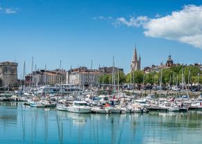 the old harbor of la rochelle, france lined with sailboats