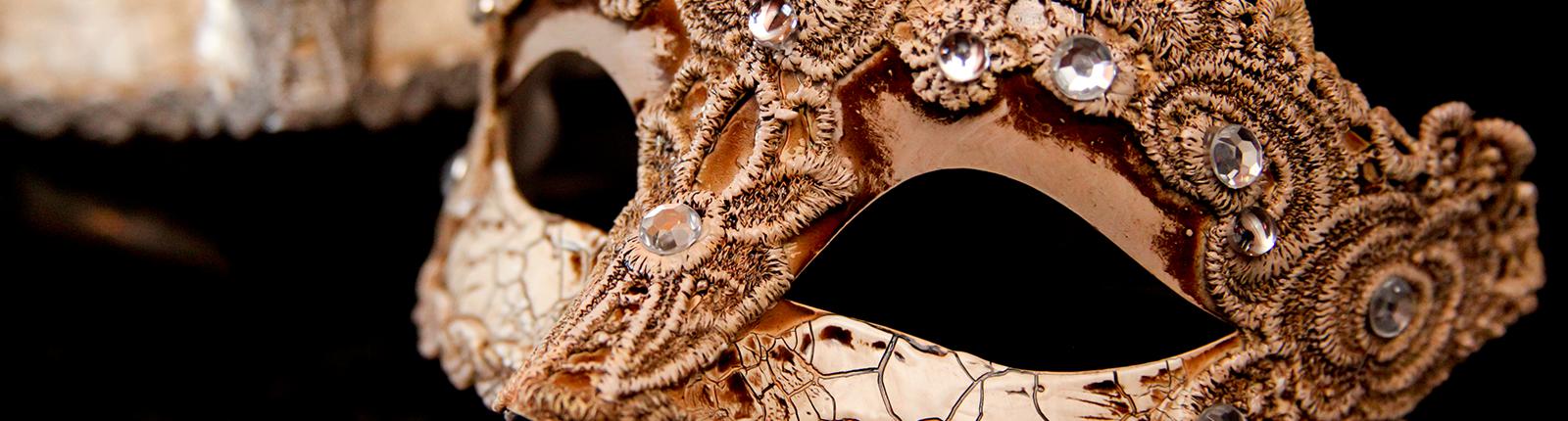 Beautiful Mardi Gras style mask seen in the Mobile Carnival Museum in Mobile, AL