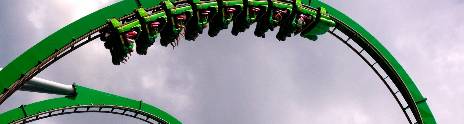 Theme park goers riding an intense roller coaster in Port Canaveral, FL