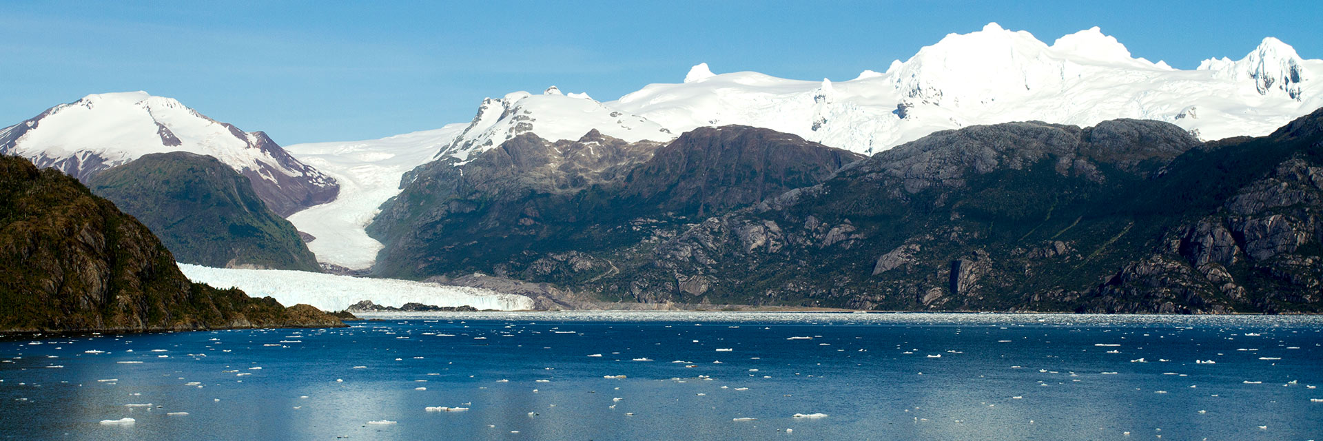 view of the water and surrounding mountain range at amalia glacier