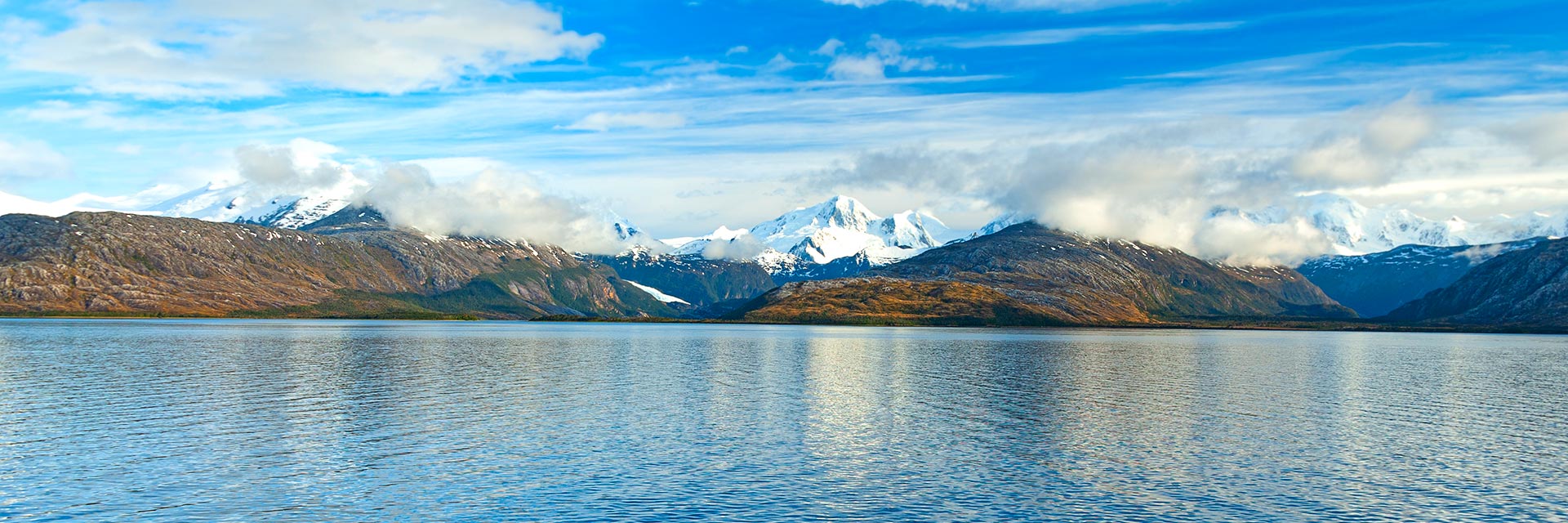 view of the snow capped mountains along the magellan strait