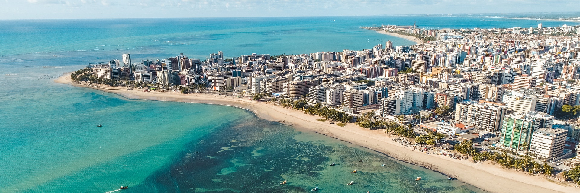 view of a natural poole coral reefs with sail boats