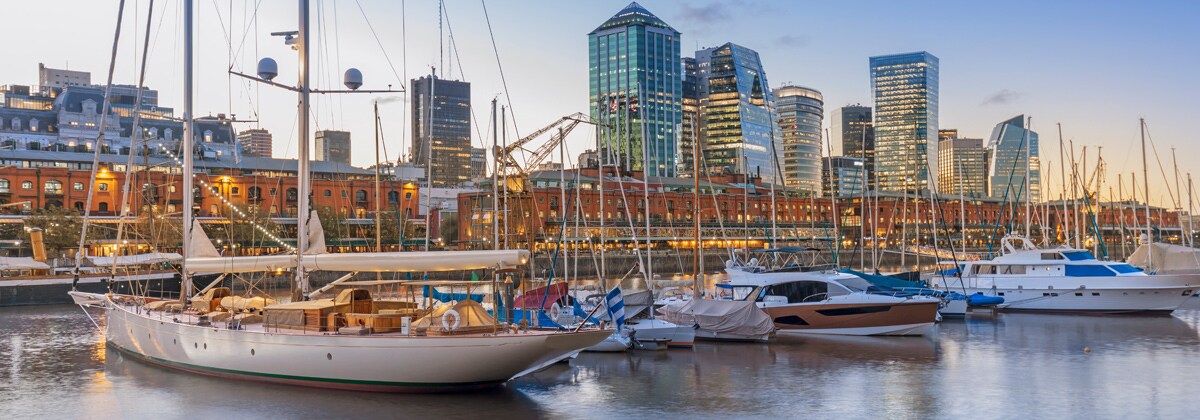 sailboats docked at a harbor during sunset in buenos aires, argentina