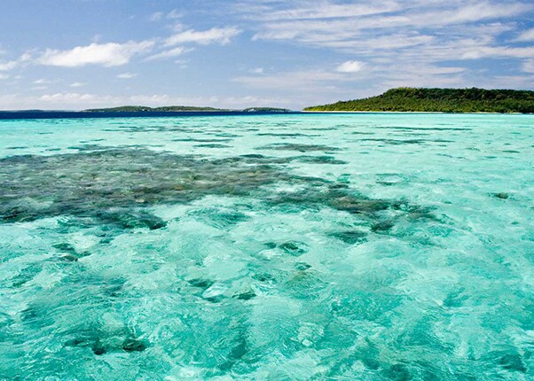 the ocean with different islands in the background
