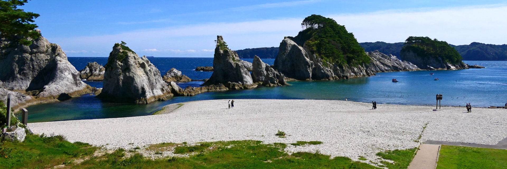rocky coastline and white pebble beach in miyako japan, with clear blue waters