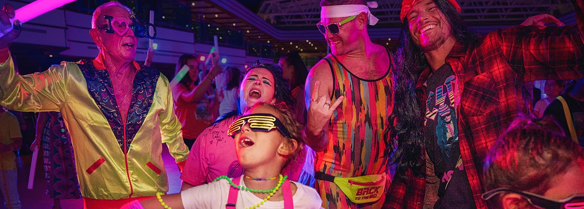 guests dancing with 80s attire