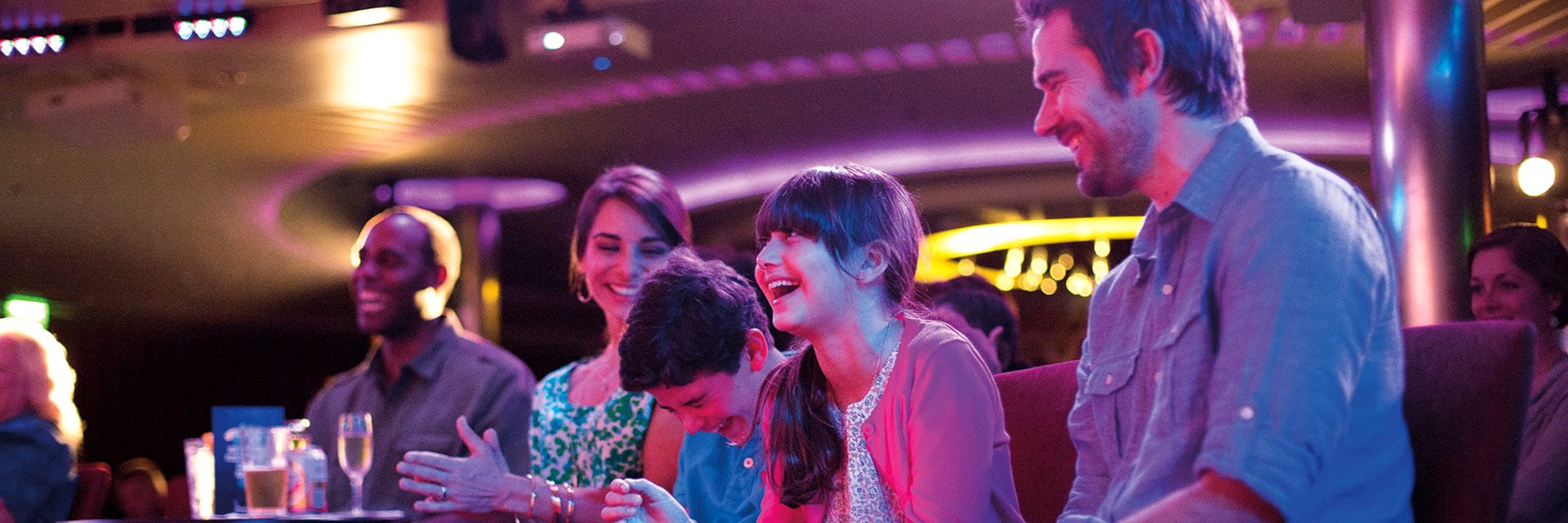 Guest enjoying a punchliner show onboard a carnival cruise