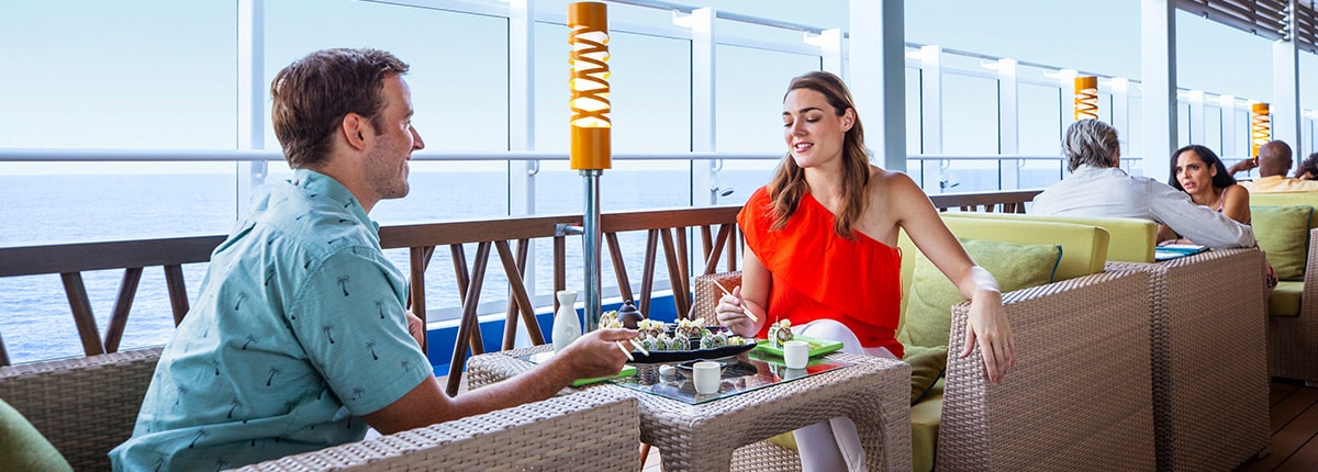 two guests sits outside bonsai sushi to enjoy a meal