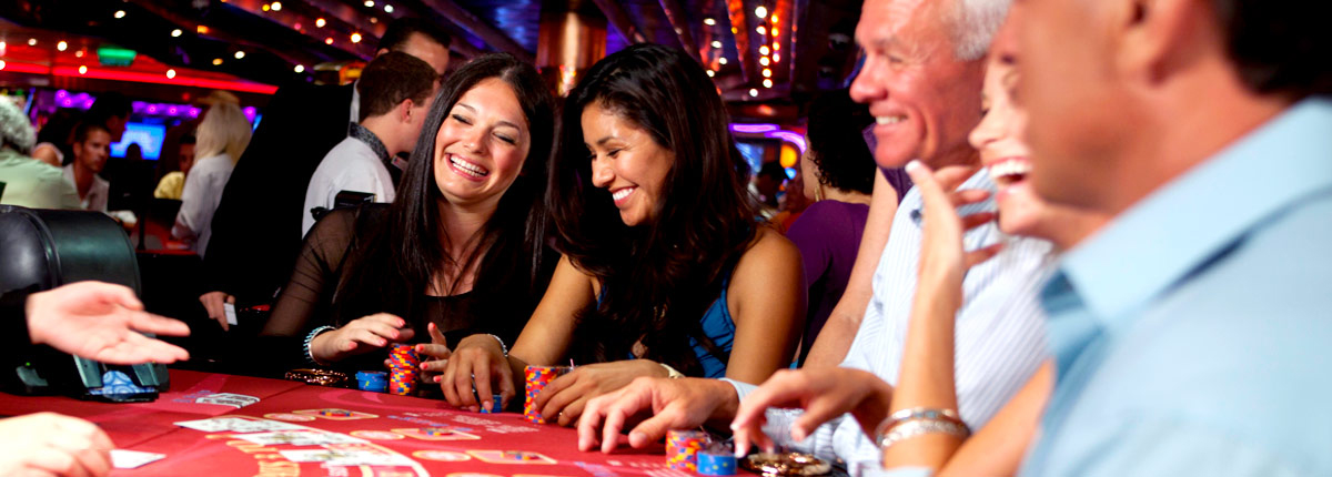 guests playing black jack at the casino on carnival cruise lines