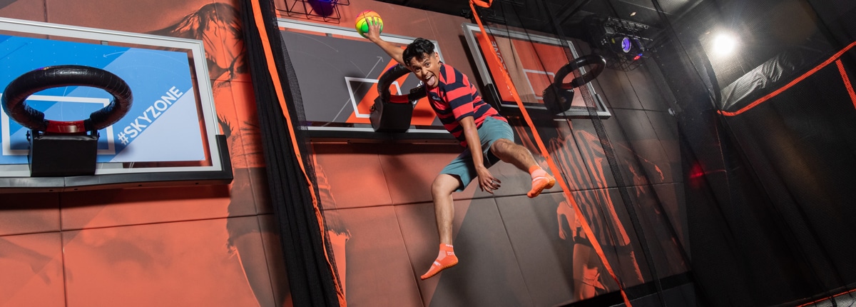 guest dunking basketballs at sky zone