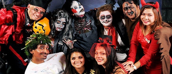 group of guests posing in halloween costumes
