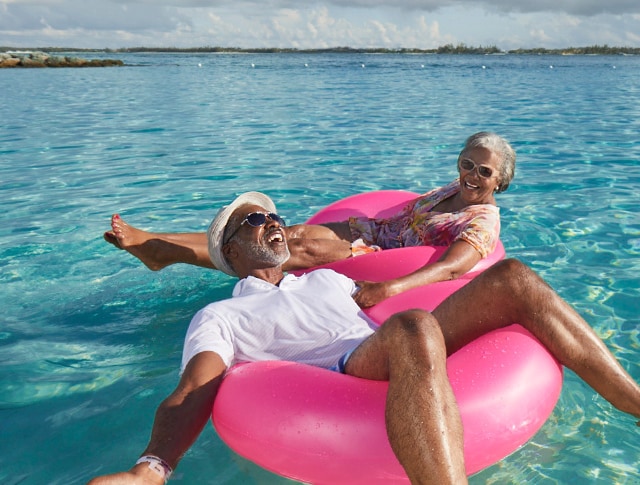 couple floating on beach floats