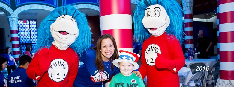 boy at st. jude children's hospital celebrates day of play with thing 1 and thing 2 in 2016