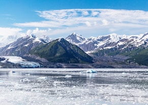 A view of snow capped mountains by Hubbard Glacier