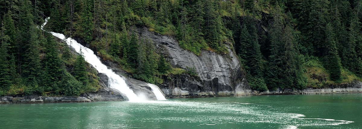 gorgeous view of mountain waterfalls in tracy arm fjord