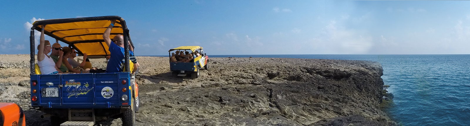 Riding in open air Jeeps along rocky terrain in Aruba