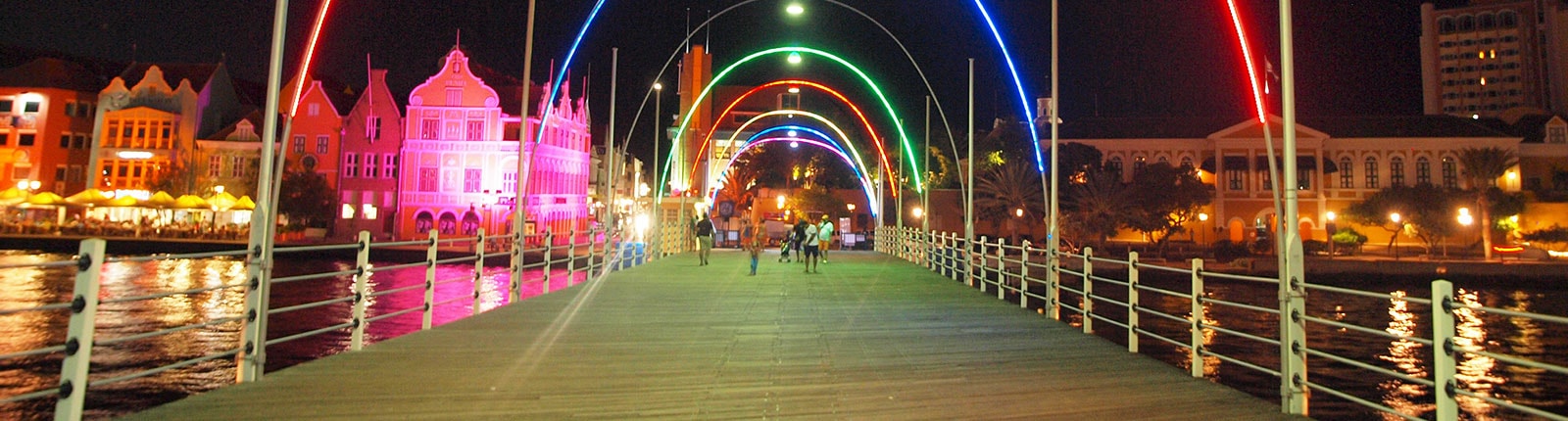Neon lit colors framing a dock in Curacao