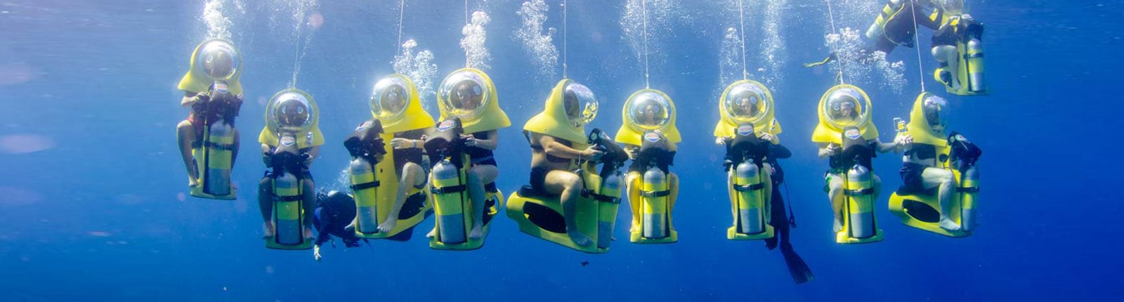 Group of scuba scooters under the water in Mahogany Bay, Isla Roatan