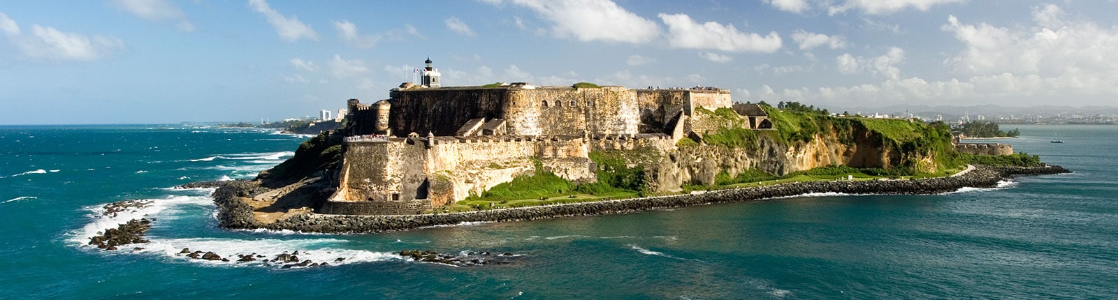 Set back view of the historic fortress on the waters edge in San Juan, Puerto Rico