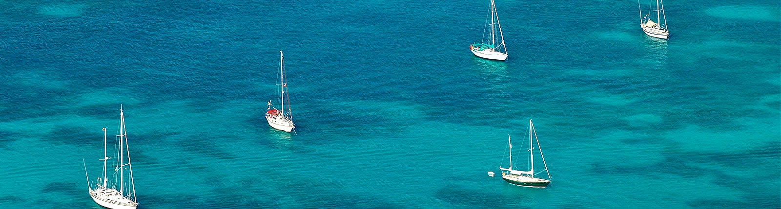 Aerial view of sailboats anchored in shallow waters of St. Maarten