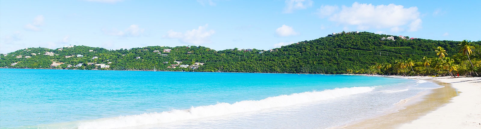 Bright blue waters lapping the beach in St. Thomas, US Virgin Islands